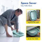 Blue collapsible foot soaking tub with textured bottom for massage, shown unfolded and ready for use.