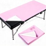 Pink rectangular ASTONFOG PU leather lash bed cover on a professional massage table, showcasing its smooth, waterproof surfac