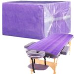 Stack of 100 Breling purple disposable bed sheets, unfolded on a massage table, showcasing their size and color.