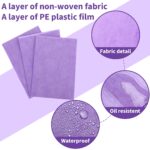 Stack of 100 Breling purple disposable bed sheets, unfolded on a massage table, showcasing their size and color.
