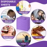 Stack of 100 Breling purple disposable bed sheets, unfolded on a massage table, showcasing their size and color.