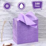 Stack of 100 Breling purple disposable bed sheets, unfolded on a massage table, showcasing their size and color.