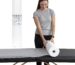 Roll of MASERTIO Disposable Massage Bed Covers, white non-woven material, for professional spa and salon use.