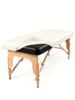 Off-white PU leather waterproof massage table cover with elastic edges, shown fitted on a massage bed.