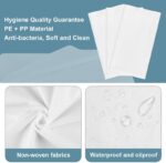 Stack of 100 white OUMETE disposable massage table sheets, unfolded to show their rectangular shape and texture.