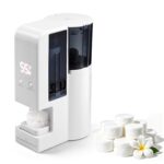 SUMBOHK hot towel warmer machine on a countertop, dispensing a warm, moist towel for facial use.