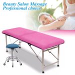 Stack of 20 pink disposable non-woven fabric massage table sheets, folded neatly.
