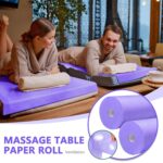 Two rolls of purple Tudomro disposable non-woven massage table sheets, unrolled slightly to show texture.