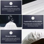 Stack of 30 white disposable fitted massage table sheets with elastic edges, on a spa table.