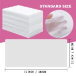 Stack of 100 white disposable non-woven bed sheets for massage tables and spa beds, neatly folded.